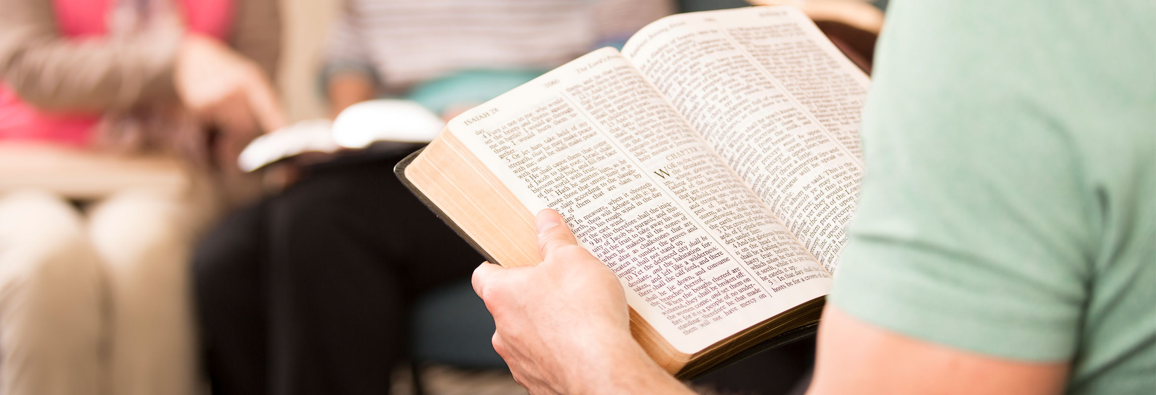 Man and woman studying a Bible while in class image